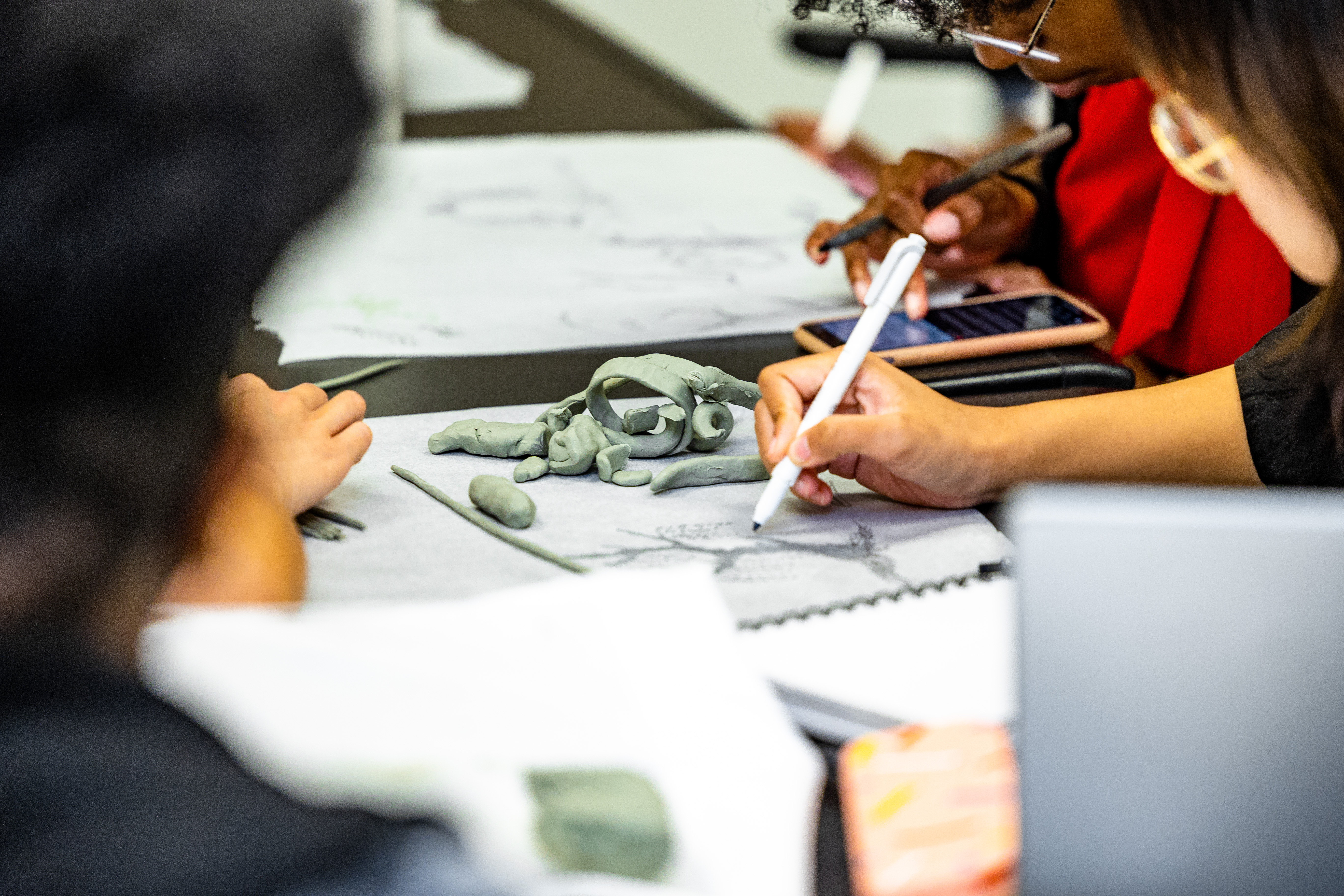 University of Memphis students collaborate on different ideas for the BlueOval City sculpture.
